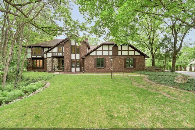 4439 Indian Trl, Green Bay, WI 54313 - back of property with a yard, brick siding, a chimney, and a balcony