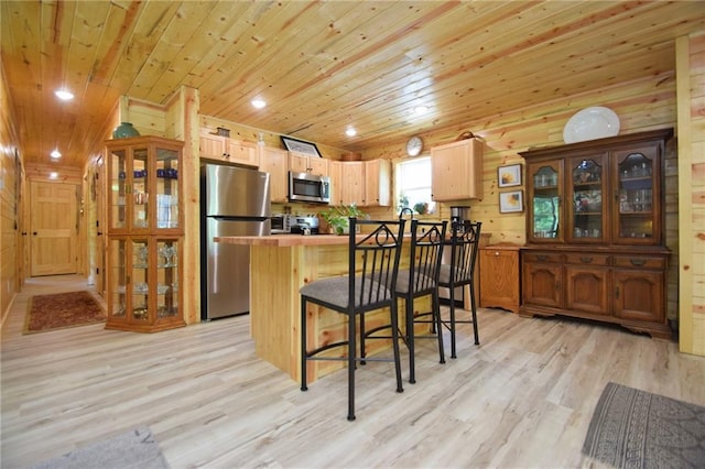 3542 Treasure Island Ter, Danbury, WI 54830 - kitchen with stainless steel appliances, wooden ceiling, light wood-style floors, a kitchen bar, and glass insert cabinets