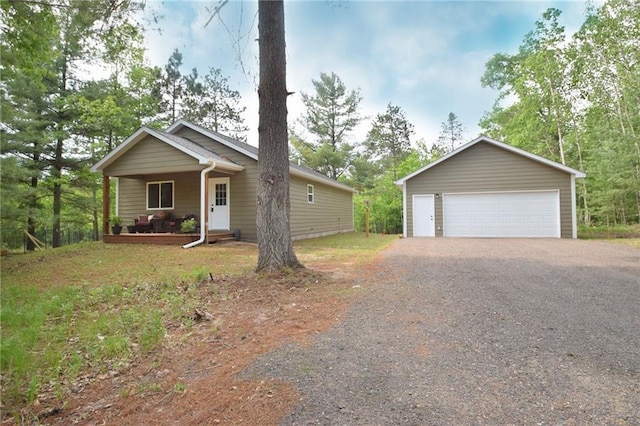 3542 Treasure Island Ter, Danbury, WI 54830 - view of front of home featuring covered porch, a garage, and an outdoor structure