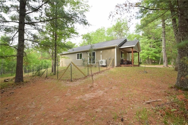 3542 Treasure Island Ter, Danbury, WI 54830 - back of house featuring covered porch and a cooling unit