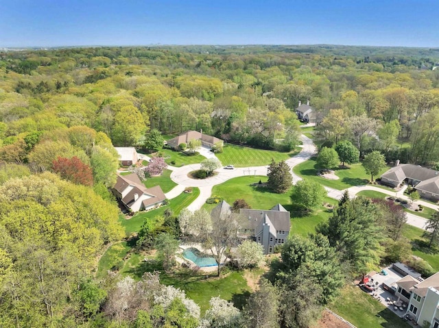 4514 Mohawk Ct, Green Bay, WI 54313 - view of property location with a heavily wooded area and a pool area