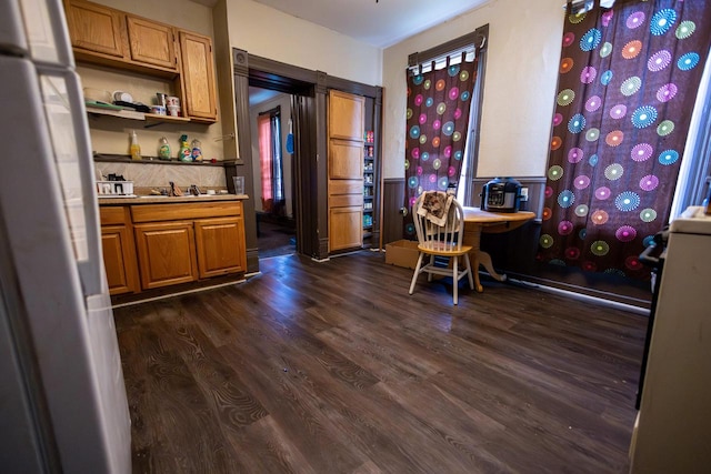 137 W Hadley St Unit 139, Milwaukee, WI 53212 - kitchen featuring freestanding refrigerator, dark wood-type flooring, open shelves, brown cabinets, and a sink
