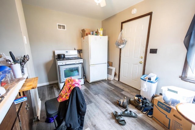 3819 W Douglas Ave, Milwaukee, WI 53209 - kitchen featuring white appliances and dark wood-style floors