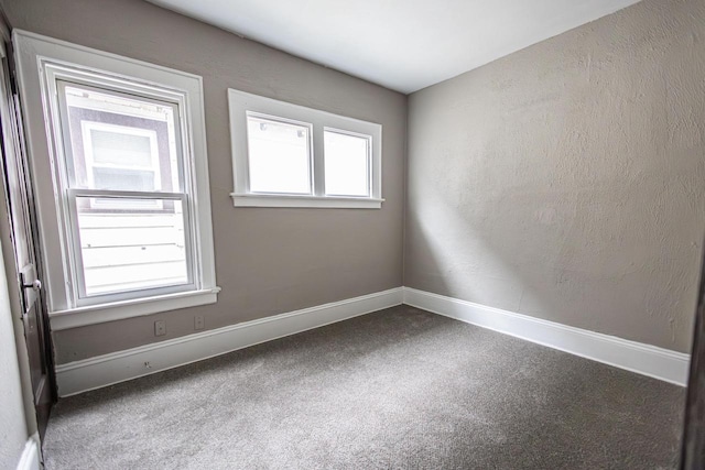 2162 N 41st St Unit 2164, Milwaukee, WI 53208 - empty room featuring carpet floors, plenty of natural light, and baseboards