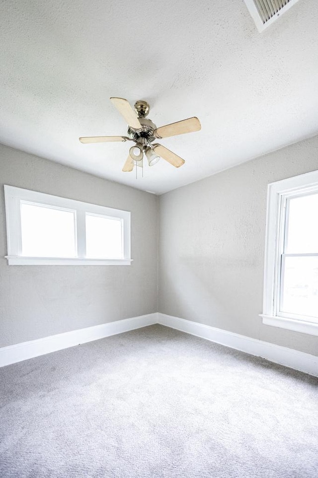 2162 N 41st St Unit 2164, Milwaukee, WI 53208 - empty room with carpet flooring, a ceiling fan, baseboards, and a textured ceiling