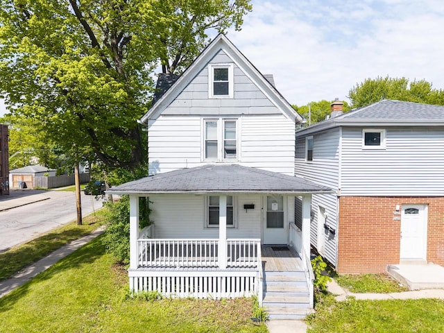 5403 N 37th St, Milwaukee, WI 53209 - traditional style home featuring covered porch and a shingled roof