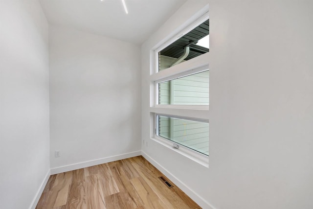 3644 W Hank Ave, De Pere, WI 54115 - unfurnished room featuring healthy amount of natural light, light wood-type flooring, and baseboards
