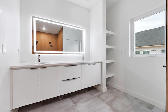 3644 W Hank Ave, De Pere, WI 54115 - bathroom featuring double vanity, baseboards, and tile patterned flooring