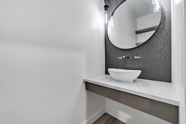 3644 W Hank Ave, De Pere, WI 54115 - bathroom featuring wood finished floors, baseboards, and vanity