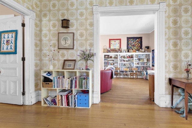 1616 7th St, Menomonie, MI 49858 - hallway featuring wood-type flooring, wallpapered walls, and ornamental molding