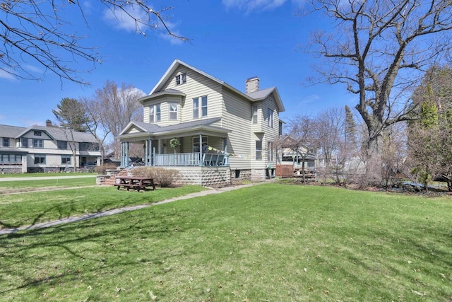 1616 7th St, Menomonie, MI 49858 - view of front of property featuring a chimney, a porch, and a front yard