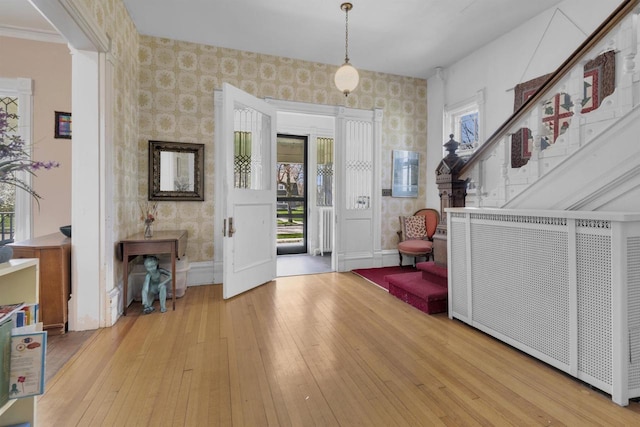 1616 7th St, Menomonie, MI 49858 - foyer with wallpapered walls, healthy amount of natural light, hardwood / wood-style floors, and baseboards