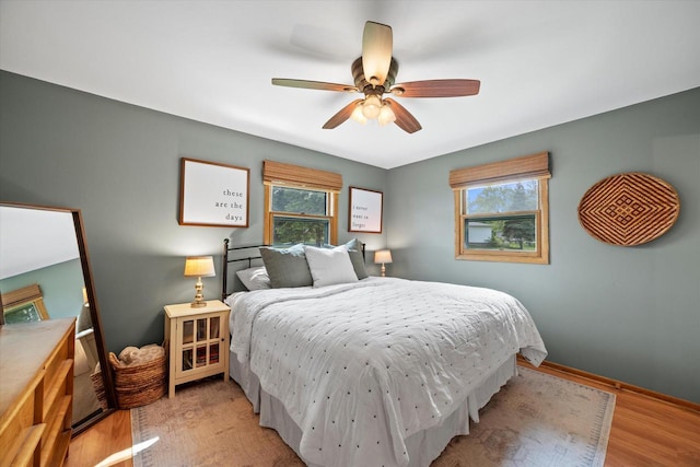 4062 S 106th St, Greenfield, WI 53228 - bedroom with wood finished floors, a ceiling fan, and baseboards