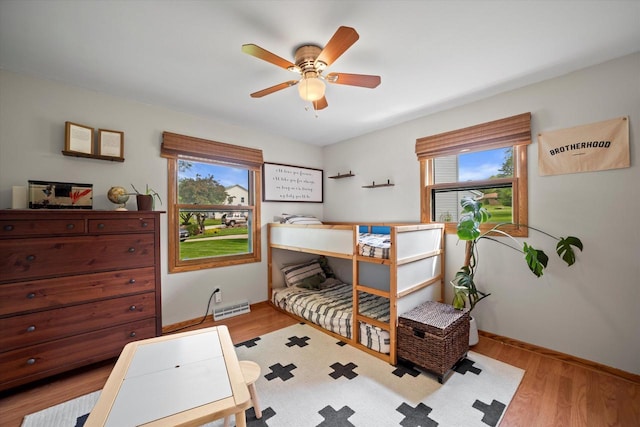 4062 S 106th St, Greenfield, WI 53228 - bedroom featuring baseboards and wood finished floors