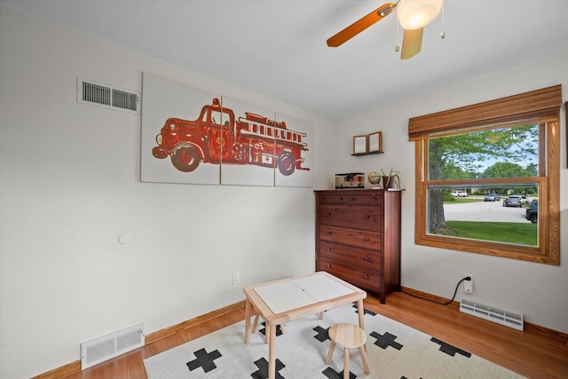 4062 S 106th St, Greenfield, WI 53228 - office area featuring wood finished floors, a ceiling fan, and baseboards