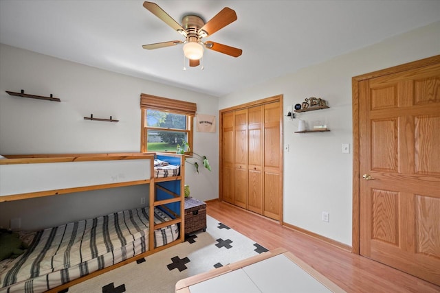 4062 S 106th St, Greenfield, WI 53228 - bedroom with light wood-style flooring, a closet, baseboards, and ceiling fan