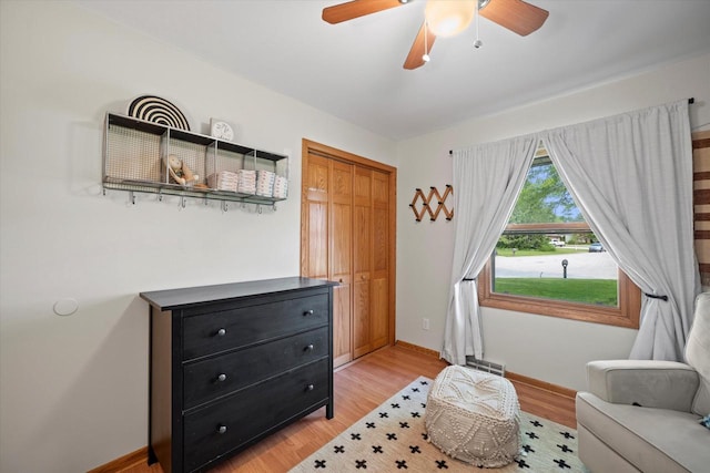 4062 S 106th St, Greenfield, WI 53228 - sitting room with light wood-type flooring, baseboards, and a ceiling fan