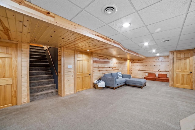 4062 S 106th St, Greenfield, WI 53228 - carpeted living area featuring wood walls, stairs, and recessed lighting