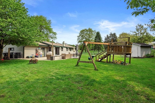4062 S 106th St, Greenfield, WI 53228 - view of green lawn with a playground and a patio area