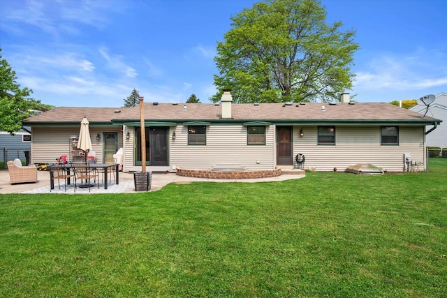 4062 S 106th St, Greenfield, WI 53228 - back of house featuring a patio area and a chimney
