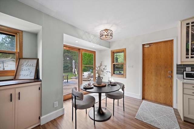 4062 S 106th St, Greenfield, WI 53228 - dining room featuring light wood-style flooring and baseboards