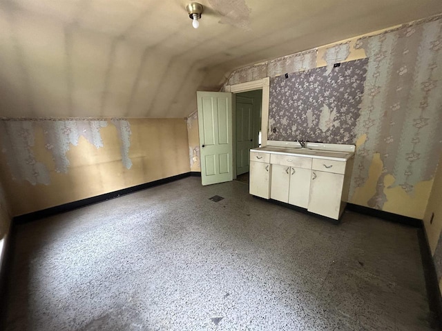 1108 6th St, Beloit, WI 53511 - bonus room with lofted ceiling, baseboards, and a sink