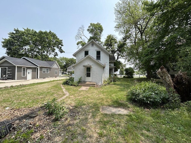 1108 6th St, Beloit, WI 53511 - rear view of house with a yard