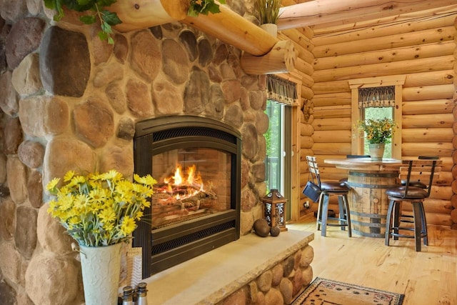 W6034 N Lake Dr, New Lisbon, WI 53950 - detailed view of wood finished floors, a fireplace, and rustic walls