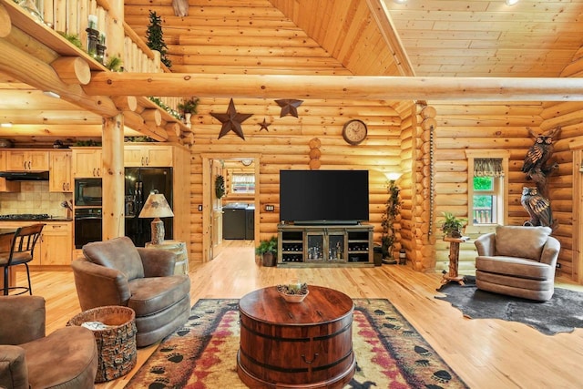 W6034 N Lake Dr, New Lisbon, WI 53950 - living area with light wood finished floors, rustic walls, and wooden ceiling