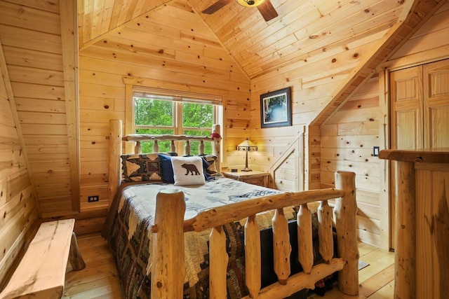 W6034 N Lake Dr, New Lisbon, WI 53950 - bedroom with wooden ceiling, wood walls, lofted ceiling, light wood-type flooring, and ceiling fan