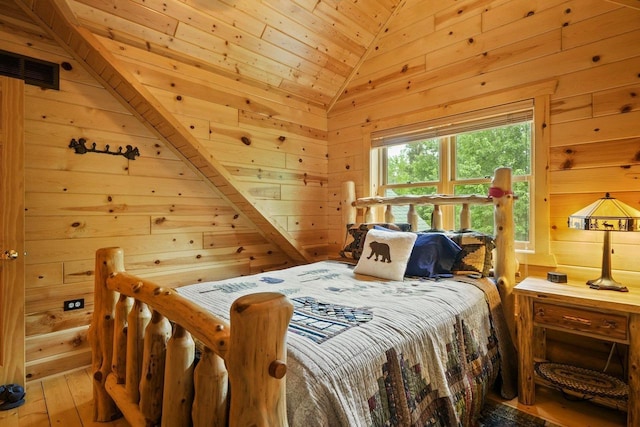 W6034 N Lake Dr, New Lisbon, WI 53950 - bedroom with wooden walls, vaulted ceiling, wood-type flooring, and wooden ceiling