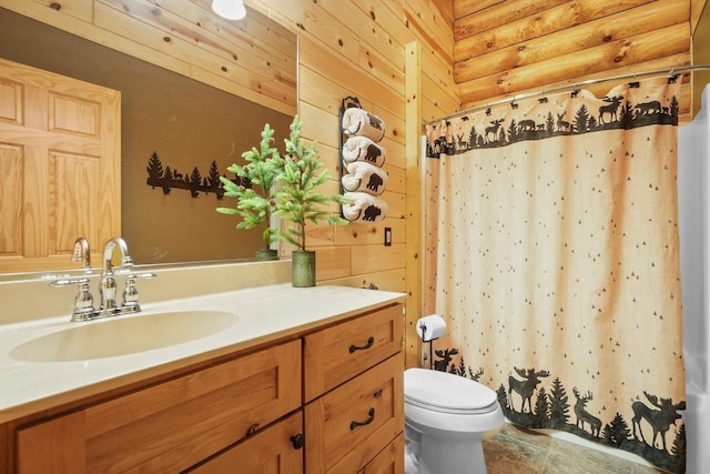 W6034 N Lake Dr, New Lisbon, WI 53950 - full bathroom with vanity, toilet, curtained shower, and wooden walls