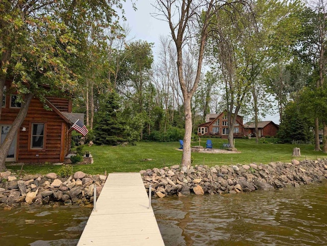 9213 Willow Ln, Fremont, WI 54940 - dock area with a lawn, a water view, and an outdoor fire pit