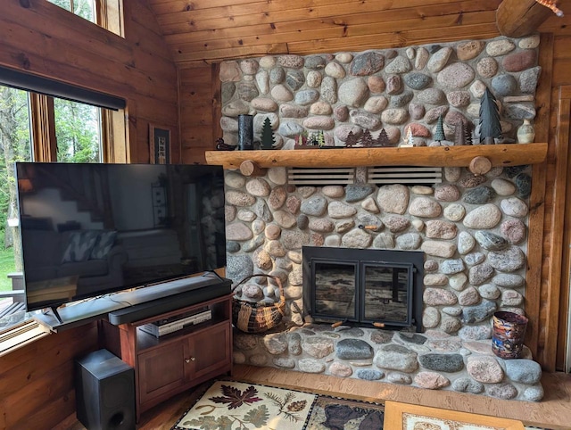 9213 Willow Ln, Fremont, WI 54940 - detailed view of a stone fireplace, wooden ceiling, and wood finished floors