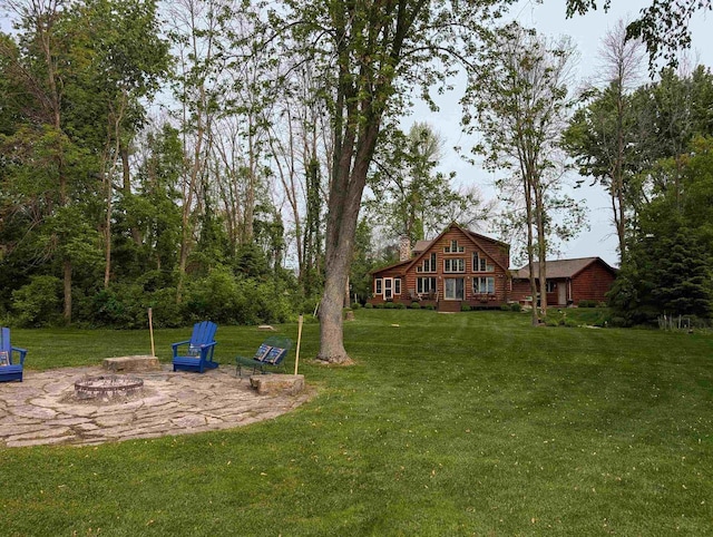 9213 Willow Ln, Fremont, WI 54940 - view of green lawn featuring an outdoor fire pit and a patio