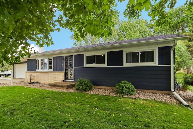 109 County Park Rd, Waupun, WI 53963 - single story home with an attached garage, a front lawn, and brick siding