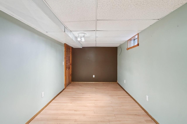 109 County Park Rd, Waupun, WI 53963 - below grade area featuring a drop ceiling, light wood-style flooring, and baseboards