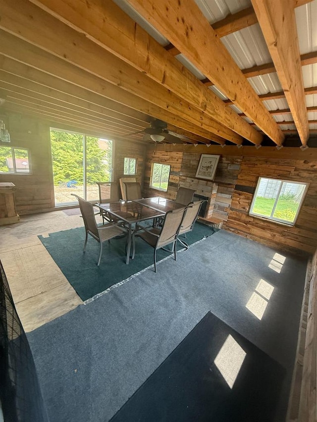 109 County Park Rd, Waupun, WI 53963 - dining area featuring wooden walls and a ceiling fan