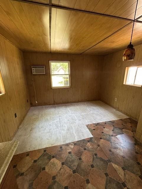 N6812 Eddy Rd, Black River Falls, WI 54615 - spare room featuring wood ceiling, healthy amount of natural light, and wood walls