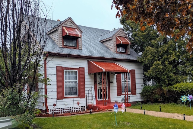 3861 N 41st St, Milwaukee, WI 53216 - cape cod home featuring a front lawn and roof with shingles