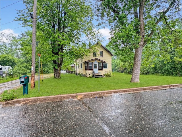711 Cleveland Ave, Ladysmith, WI 54848 - traditional home featuring a front lawn