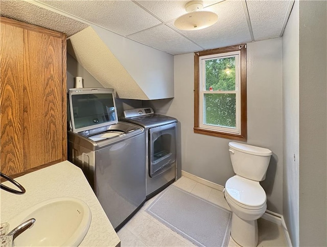 711 Cleveland Ave, Ladysmith, WI 54848 - laundry room featuring washer and clothes dryer and baseboards