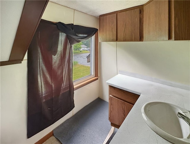 711 Cleveland Ave, Ladysmith, WI 54848 - bathroom with a textured ceiling and vanity