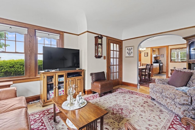 11203 W Potter Rd, Wauwatosa, WI 53226 - living room featuring wood finished floors, baseboards, and arched walkways