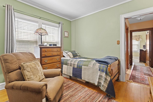 11203 W Potter Rd, Wauwatosa, WI 53226 - bedroom with multiple windows, hardwood / wood-style flooring, and ornamental molding