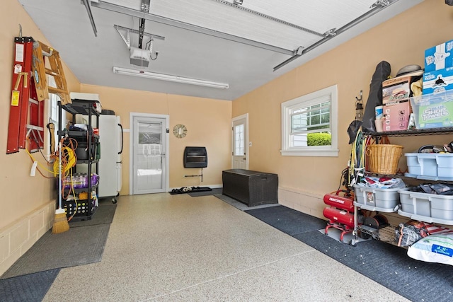11203 W Potter Rd, Wauwatosa, WI 53226 - garage featuring freestanding refrigerator and a garage door opener