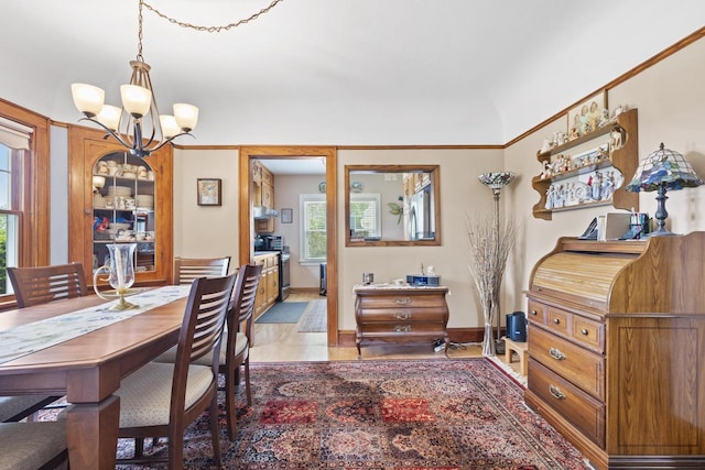 11203 W Potter Rd, Wauwatosa, WI 53226 - dining space with a chandelier, healthy amount of natural light, and baseboards