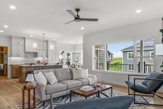 6562 Norski Ct, Windsor, WI 53598 - living area featuring recessed lighting, a chandelier, light wood-type flooring, and ceiling fan