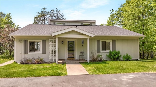 10787 Reynolds Rd, Hayward, WI 54843 - view of front of home with a front lawn and roof with shingles