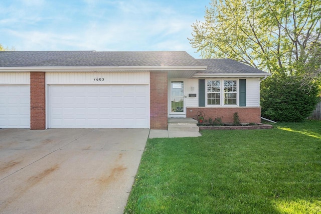 1603 Maplewood Dr, Little Chute, WI 54140 - view of front of home featuring driveway, brick siding, a front lawn, and an attached garage